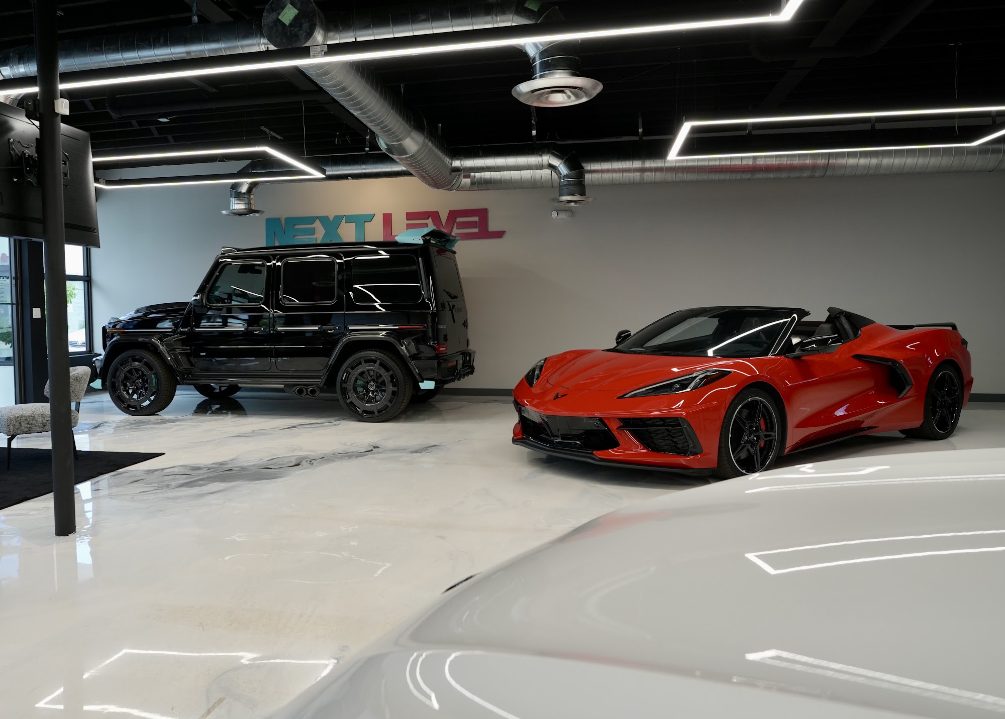 G-Class and Corvette on the Next Level Motors showroom floor